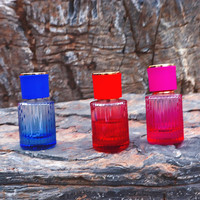 Vaporisateur de parfum de 30ml 50ml 100ml Flacon de parfum vide en verre de forme ronde transparent avec bouchons multicolores