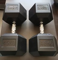 Ensemble d'haltères hexagonales en fonte avec revêtement en caoutchouc noir pour la musculation à domicile et en salle de sport