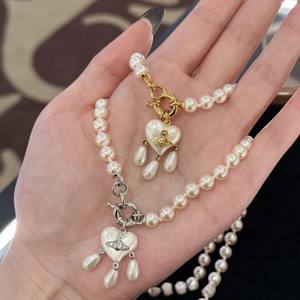 Collar y Pendientes de Perlas de Tres Gotas Saturno Versión Alta Western Queen Mother Vivienne, Joyería de Corazón con Borla Atrapasueños - Product Image 3