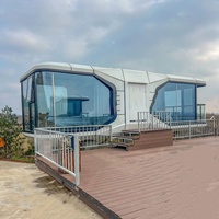 Maison capsule moderne de luxe en acier préfabriquée de 40 pieds, 1/2 chambre, mini-maison Apple, capsule spatiale solaire, salon, salle de bain pour usage hôtelier