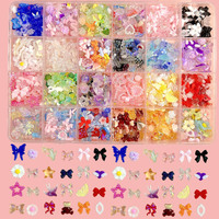 Meilleure vente en vrac 3D Rose fleurs papillon arc perle camélia résine ongles breloques bijoux accessoires Kawaii 24 grille ongles breloques