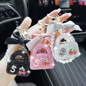 Cross-border Full Diamond Bag <b>Keychain</b> Creative Pearl Chain Bow Shiny Diamond Pendant <b>Personalized</b> Exquisite Car - Product Image 3