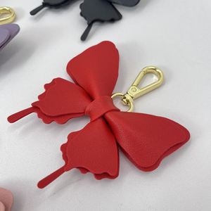 Porte-clés papillon mignon en cuir PU, 6 couleurs, pendentif pour sac à main pour femme, accessoire de mode de haute qualité et durable - Product Image 6