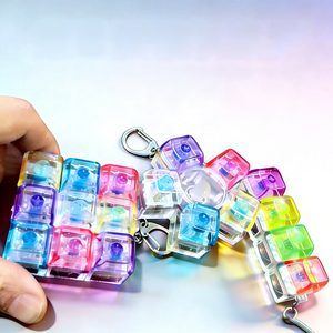 เครื่องทดสอบคีย์บอร์ดแบบใสขายดี ของเล่นคลายเครียดแบบพวงกุญแจ กดปุ่มไฟกระพริบ ของเล่นกดปุ่มปลายนิ้ว - Product Image 1