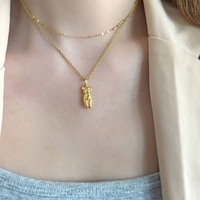 Collier Bowei à superposition, design géométrique ajouré original pour femme