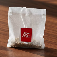 Meilleur prix, qualité alimentaire, logo personnalisé, sachet de thé en nylon thermoscellable de haute qualité avec cordon pour l'emballage des feuilles de thé