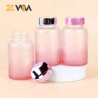 Bouteille en verre vide rose dégradé en gros, sérigraphiée couleur personnalisée avec couvercle à vis