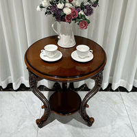 Fauteuil de loisirs en cuir véritable de première qualité de style européen avec accoudoirs sculptés et petite table intégrée pour salon et bureau