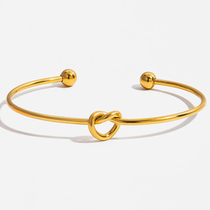 Bracelet à manchette tendance, design nœud papillon doré, bijoux unisexes, cadeau - Product Image 1