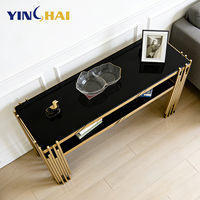 Table console de luxe en acier inoxydable 201 avec cadre en métal doré sur mesure, plateau en verre noir, mobilier pour suite d'hôtel