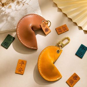 In stock: Crescent moon dumpling <b>leather</b> <b>keychain</b> pendant, lucky charm, peace amulet key accessory. - Product Image 1