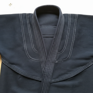 ชุดฝึกคาราเต้ทนทานแบบมืออาชีพเสื้อผ้าศิลปะการต่อสู้สำหรับผู้ใหญ่ทั้งชายและหญิงผ้าแคนวาส - Product Image 1