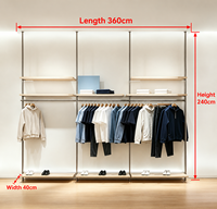 Portant à vêtements sur mesure en métal et bois, du sol au plafond, avec étagères et éclairage LED pour boutique de prêt-à-porter