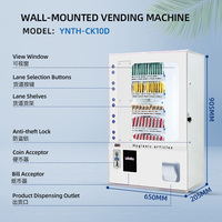 Distributeur automatique mural multicanal de produits d'hygiène pour toilettes, sans personnel, pour l'approvisionnement transfrontalier