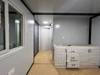 Tiny House, maison conteneur extensible de 20 pieds avec panneaux gris et structure noire, maison conteneur préfabriquée