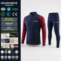 Conjunto de chándal de 2 piezas para hombre con cremallera de cuarto, manga raglán, estampado contorneado, pantalones de chándal cónicos con cintura elástica y cremallera en el tobillo, producción OEM