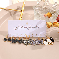 Vente en gros de boucles d'oreilles créatives avec pendentifs en forme de papillon noir, ensemble de boucles d'oreilles Tai Chi en forme de cœur, accessoires pour femmes