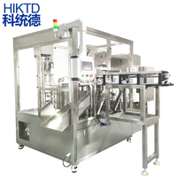 Machine de remplissage et de capsulage de poche à tête de champignon à quatre têtes entièrement automatique