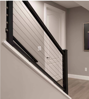 Rampe intérieure avec câble métallique, balustrade noire avec main courante