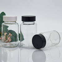 Vente en gros de bouteilles en verre rondes transparentes de 65ml 100ml bouteilles de pilules pharmaceutiques capsule de médicaments bouteilles en forme de pilules avec bouchon