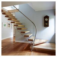 Escalier flottant de style moderne avec marches en bois massif et garde-corps en verre trempé, structure cachée de luxe pour une sécurité accrue
