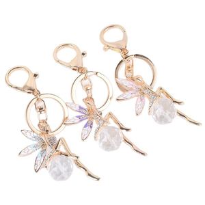 Nouveau porte-clés exquis en forme d'ailes d'ange incrustées de diamants pour fille, avec pendentif en métal huilé, accessoire de sac, bijou pour clés de voiture - Product Image 1