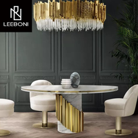 Ensemble de tables rondes de salle à manger de luxe léger avec plateau en marbre naturel et pieds en acier inoxydable, 6 chaises