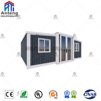Maison conteneur préfabriquée pliable et extensible à panneaux sombres avec grande véranda, cabane spacieuse pour invités, idéale pour les vacances dans le jardin