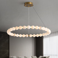Lustre moderne en laiton et marbre alabastro, luminaire suspendu à anneaux flottants multi-niveaux pour villa, hall d'hôtel, salon