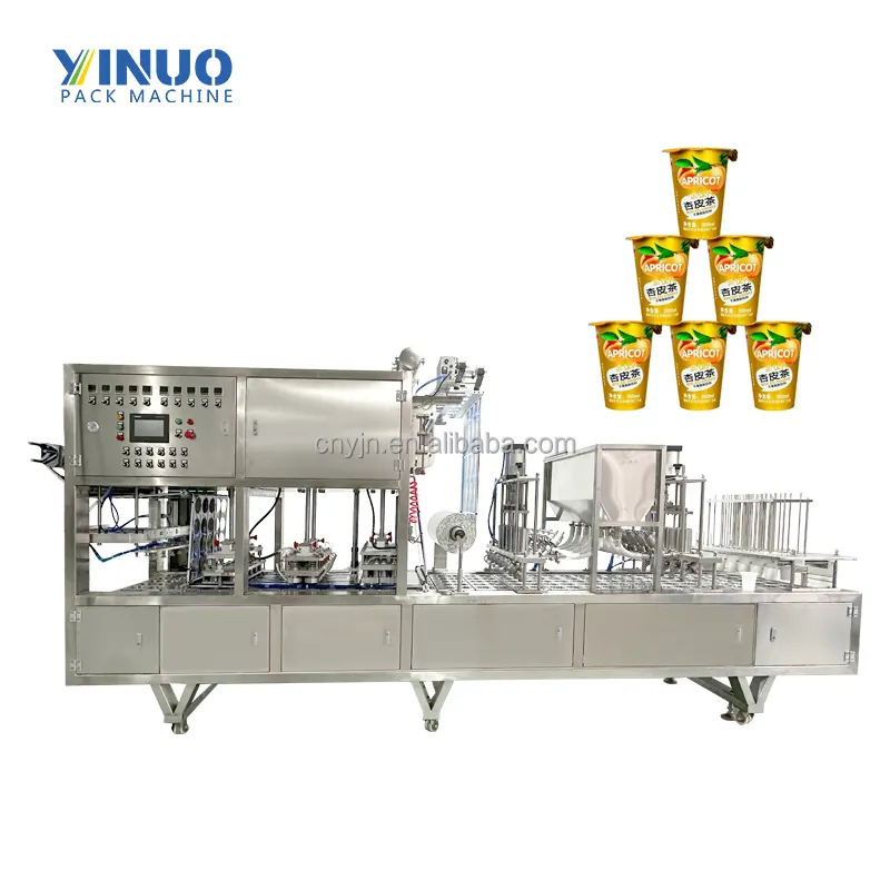 Remplissage de tasses de jus de fruit de l'eau liquide de capacité de production élevée et machine en plastique de cachetage automatiques