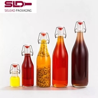 Bouteille en verre personnalisée à bouchon basculant pour boissons, jus, eau, bière, bouteille en verre ronde 60ml 150ml 250ml 500ml 750ml