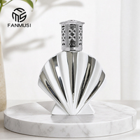 Diffuseur de parfum catalytique en céramique en forme de coquille de 450 ml avec mèche et capuchon métallique argenté, logo et emballage personnalisés