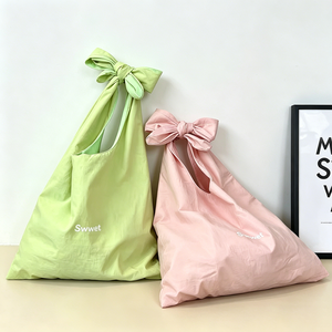 <span class=keywords><strong>Sac</strong></span> fourre-tout tendance en <span class=keywords><strong>coton</strong></span> biologique, pliable, brodé, avec nœud, bandoulière longue nouée, pour le shopping, le voyage et la plage - Product Image 1