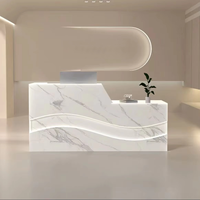 Comptoir de réception de luxe en forme de vague, réversible gauche-droite, avec bande LED pour hôtel et salon