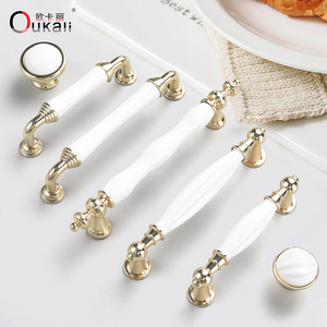 Poignées et boutons de porte en alliage de zinc en céramique blanche moderne de luxe de 128mm or K de haute qualité pour armoires de cuisine tiroirs de <span class=keywords><strong>commode</strong></span> - Product Image 1
