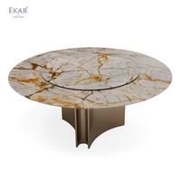 Table à manger circulaire contemporaine avec surface texturée superposée et base géométrique pour villa et restaurant