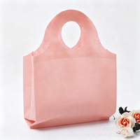 Sac fourre-tout en non-tissé épaissi avec poignée à trous ronds, sac cadeau de boutique haut de gamme, sac de rangement réutilisable pour exposition, vente en gros