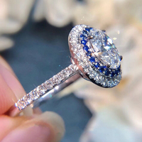 CAOSHI Design Argent Revêtement Ovale Coupe Grand Zircon Bague De Luxe Pierre Bleue Bague De Promesse De Mariée Femmes