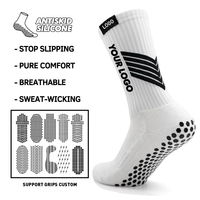 Chaussettes de football antidérapantes pour jeunes hommes avec technologie de grip, design personnalisable et logo sur le dessous, longueur mi-mollet