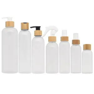 Cosmetic Packing 8oz bamboo shampoo pump bottle 4oz 250ml 16oz clear Frost Plastic Lotion oil Bottle With Bamboo spray pump disc