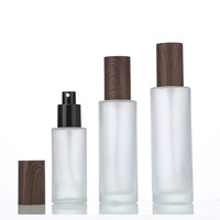 Bouteille en verre pulvérisable avec capuchon à motif grain de bois par impression par transfert à l'eau foncée