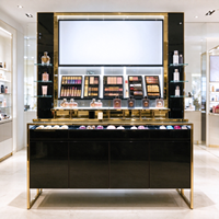 Vitrine de présentation cosmétique noire et or, comptoir îlot, vitrine à parfums en verre, boîte lumineuse, armoires murales pour grand magasin CE ETL