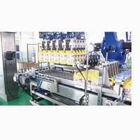 Machine d'emballage automatique numérique pour le remplissage, le bouchage, le scellage et l'étiquetage de liquides (huile lubrifiante, boissons et aliments) en canettes de 1 à 5 L