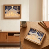 Veilleuse de Noël 3D en papier découpé sur fond bleu foncé avec cadre en bois, décoration de maison de Noël