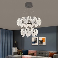 Lustre en cristal circulaire à double couche en forme de feuille de pin, avec traitement de surface doré et design moderne