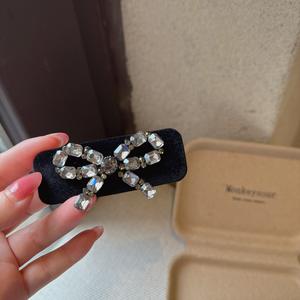 Barrettes à cheveux mignonnes en strass de luxe, avec nœud, comme accessoire pour cheveux pour femmes - Product Image 1