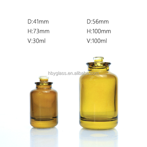 ขวดน้ำหอมทรงกระบอกแบบเติมได้ ขนาด 30 มล. 50 มล. 100 มล. ทำจากแก้วสีเหลืองอำพัน พร้อมหัวฉีดและฝาสีดำ - Product Image 2