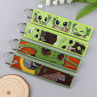 Nouveau Porte-clés Brodé Personnalisé Monstre Vert de Dessin Animé Populaire en Gros avec Logo Tissé Anime
