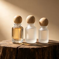 Flacon de parfum cylindrique de luxe vide en verre ambré ou noir personnalisé de 30 ml, 50 ml, 100 ml avec capuchon noir sérigraphié