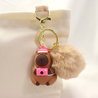 Nouvelle poupée capybara en peluche avec pompon, porte-clés en caoutchouc PVC 3D, mini porte-clés pour sac de voiture, boule de poils, chaîne de pendentif, cadeau, porte-clés